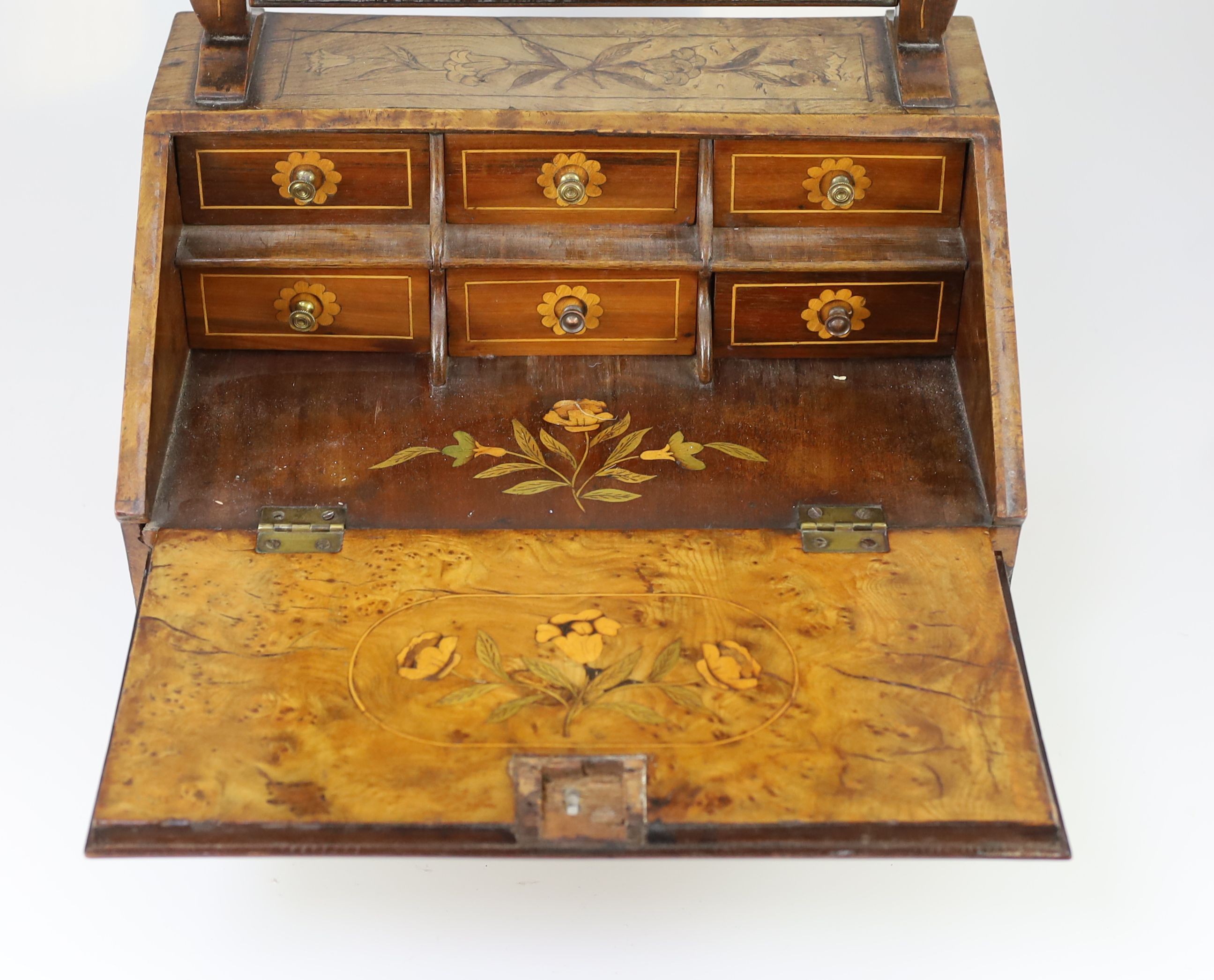 A mid to late 18th century Dutch walnut and marquetry toilet mirror bureau